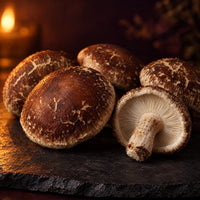 Whole shiitake mushrooms by candlelight